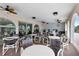 Spacious patio area with multiple tables, chairs, ceiling fans and counter with BBQ at 19029 Us Highway 19 N # 8-15, Clearwater, FL 33764