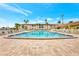 Beautiful community pool with clear blue water, plenty of seating, and lovely landscaping at 19029 Us Highway 19 N # 8-15, Clearwater, FL 33764