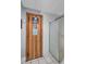 Community sauna with a wooden door, shower, and tiled walls for relaxation and wellness at 19029 Us Highway 19 N # 8-15, Clearwater, FL 33764