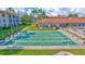 Shuffleboard courts surrounded by manicured landscaping in a tropical setting at 19029 Us Highway 19 N # 8-15, Clearwater, FL 33764
