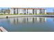 Stunning waterfront property with lush landscaping and serene water view at 19029 Us Highway 19 N # 8-15, Clearwater, FL 33764