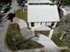 Aerial view of the house displaying a clean white roof and a curved concrete driveway at 1909 S West Shore Blvd, Tampa, FL 33629