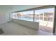 The enclosed sunroom offers views of the beautiful screened-in pool and canal at 2821 Coral Way, Punta Gorda, FL 33950