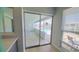 Enclosed sunroom with sliding doors provides direct access to the sparkling screened-in pool at 2821 Coral Way, Punta Gorda, FL 33950