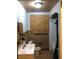 Modest bathroom featuring a toilet, sink, and a tiled shower/tub area with a boarded-up window at 3201 N 15Th St, Tampa, FL 33605