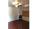 Empty bedroom featuring a ceiling fan and dark wood-look floors at 3201 N 15Th St, Tampa, FL 33605