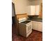 Kitchen featuring an electric range, white cabinets and green countertop at 3201 N 15Th St, Tampa, FL 33605
