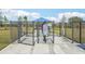 The dog park features fenced areas, a covered shelter and play equipment for your furry friends at 32231 Conchshell Sail St, Wesley Chapel, FL 33545