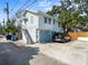 Exterior of home featuring a two-car garage and fenced yard with a paver driveway at 346 9Th Ne Ave, St Petersburg, FL 33701