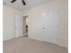 Bedroom with neutral walls and carpet, offering a comfortable and versatile space at 35583 Burma Reed Dr, Zephyrhills, FL 33541