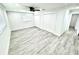 Bright bedroom features light wood floors, neutral walls, ceiling fan, and closet at 3735 69Th N Way, St Petersburg, FL 33710