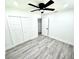 Bright bedroom features a ceiling fan, hardwood floors and white trim at 3735 69Th N Way, St Petersburg, FL 33710