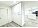 Large, bright pantry featuring plenty of cabinet storage adjacent to the living room and kitchen at 3735 69Th N Way, St Petersburg, FL 33710