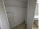 An empty closet with metal storage racks and white walls creates ample storage solutions at 375 Woods Landing Trl, Oldsmar, FL 34677