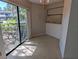 Cozy dining area featuring a large window with natural light and neutral tile floors at 375 Woods Landing Trl, Oldsmar, FL 34677