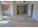 Open living area with neutral carpet and view to the kitchen at 375 Woods Landing Trl, Oldsmar, FL 34677