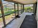 Enclosed tiled patio with views of the community green space at 375 Woods Landing Trl, Oldsmar, FL 34677