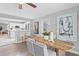 Dining room features a wood table, modern decor and view into the kitchen at 5148 23Rd N Ave, St Petersburg, FL 33710