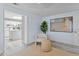 Living Room with view into Kitchen featuring a large island with white countertops at 5148 23Rd N Ave, St Petersburg, FL 33710