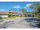 Charming two-story home with attached carport, manicured landscaping and large driveway at 5434 Saddlebrook Way # 3, Wesley Chapel, FL 33543