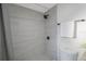 Modern bathroom with gray tile shower and sleek black fixtures at 5908 N 32Nd St, Tampa, FL 33610