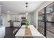 Bright dining area featuring white table and views of the backyard at 5908 N 32Nd St, Tampa, FL 33610