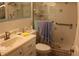 Standard bathroom featuring a toilet, sink, mirror and shower at 6000 20Th N St # 141, St Petersburg, FL 33714