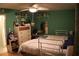 A bedroom offers a cozy space with a ceiling fan, comfortable bed, and ample storage at 6000 20Th N St # 141, St Petersburg, FL 33714