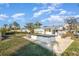 The backyard has an enclosed hot tub with room for patio furniture and backs up to the canal at 607 Manatee Ave, Ellenton, FL 34222