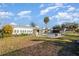 The backyard features an enclosed hot tub, well-maintained lawn space, and plenty of room to entertain at 607 Manatee Ave, Ellenton, FL 34222