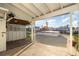 View of a backyard with a covered patio and an above-ground pool at 607 Manatee Ave, Ellenton, FL 34222