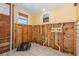 Bathroom featuring partial wood paneling, a mirror, and exposed plumbing at 607 Manatee Ave, Ellenton, FL 34222