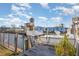 Canal-front dock featuring a boat lift, providing convenient access to the water at 607 Manatee Ave, Ellenton, FL 34222