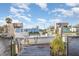 Waterfront dock with a boat lift, showing convenient boat storage and water access at 607 Manatee Ave, Ellenton, FL 34222