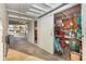 View of a garage with a sliding barn door, filled with various stored items at 607 Manatee Ave, Ellenton, FL 34222