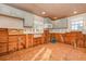 A kitchen undergoing remodel with exposed framing and a window offering natural light at 607 Manatee Ave, Ellenton, FL 34222