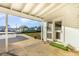 View of an outdoor patio area, with a door leading to the backyard at 607 Manatee Ave, Ellenton, FL 34222
