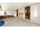 Bright open room with exposed framing, ideal for a remodel, and featuring large windows at 607 Manatee Ave, Ellenton, FL 34222