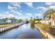 Beautiful waterfront property featuring a serene canal, private docks, and lush surroundings at 607 Manatee Ave, Ellenton, FL 34222