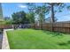 Large backyard with fresh green turf and ample patio space to enjoy outdoor living and entertaining at 686 Southwest N Blvd, St Petersburg, FL 33702