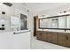 Beautiful bathroom featuring a glass shower, marble flooring and double sink at 713 W West St, Tampa, FL 33603