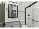 Modern bathroom featuring a glass shower, stylish vanity with modern faucet, and matte black finishes at 713 W West St, Tampa, FL 33603