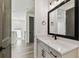 This bathroom features modern fixtures, a large mirror, and neutral decor at 713 W West St, Tampa, FL 33603