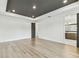 This bedroom features modern wood floors, recessed lights, and easy access to the ensuite bath at 713 W West St, Tampa, FL 33603