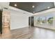 Spacious bedroom featuring wood flooring, recessed lighting and ensuite bathroom at 713 W West St, Tampa, FL 33603