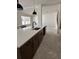Modern kitchen featuring an island with a sink and an open view of the living room at 713 W West St, Tampa, FL 33603