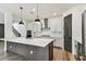 Modern kitchen with a large island, stainless steel appliances, and pendant lighting at 713 W West St, Tampa, FL 33603