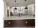 Bright, open-concept kitchen with a central island, pendant lighting, and stainless steel appliances at 713 W West St, Tampa, FL 33603