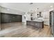 Open-concept living space showcasing a modern kitchen and a spacious seating area at 713 W West St, Tampa, FL 33603