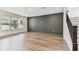 Modern living room features hardwood floors and a black accent wall at 713 W West St, Tampa, FL 33603
